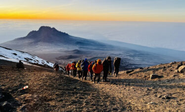 Hikers at the top of Mount Kilimanjaro