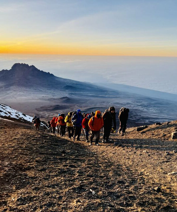 Hikers at the top of Mount Kilimanjaro