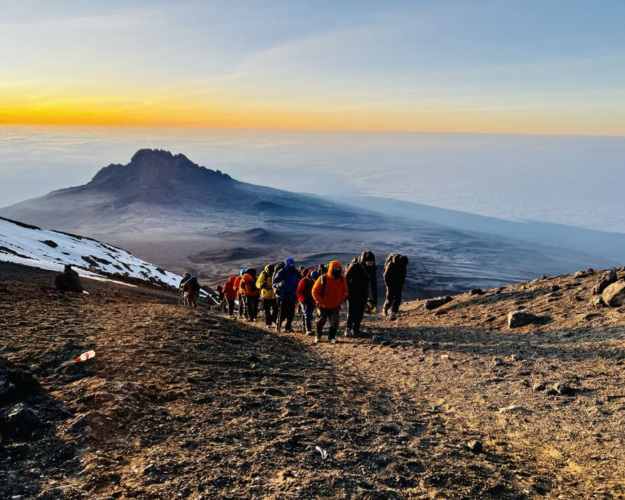 Hikers at the top of Mount Kilimanjaro