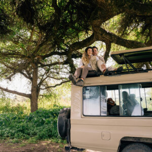 Tourists in a safari truck in one of Tanzania's national parks