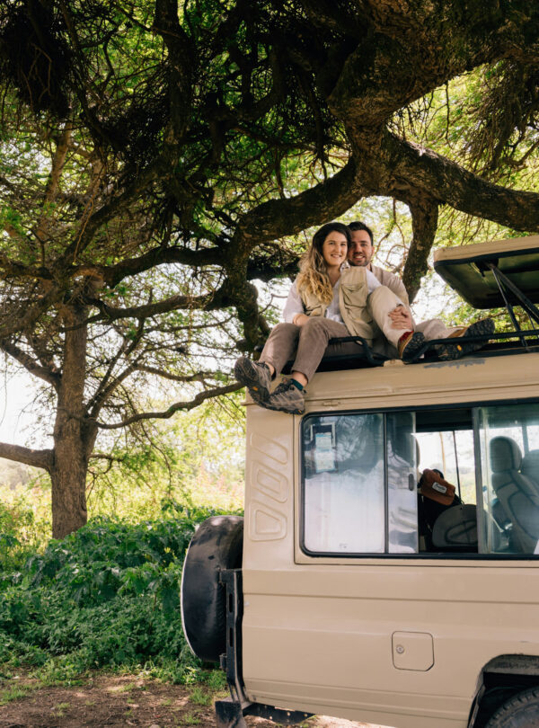 Tourists in a safari truck in one of Tanzania's national parks