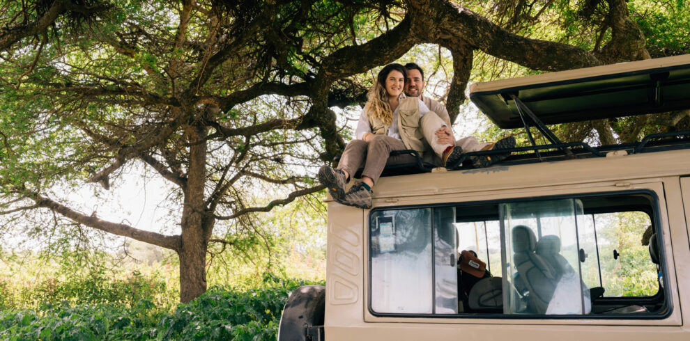 Tourists in a safari truck in one of Tanzania's national parks