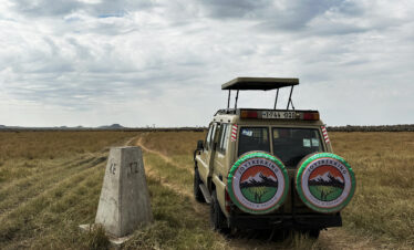 Tips for Traveling Tanzania on a Budget – company safari vehicle with local guide in Tanzania