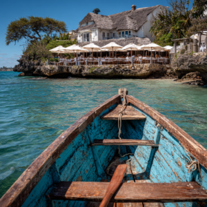 Boat approaching The Rock Restaurant at high tide in Zanzibar