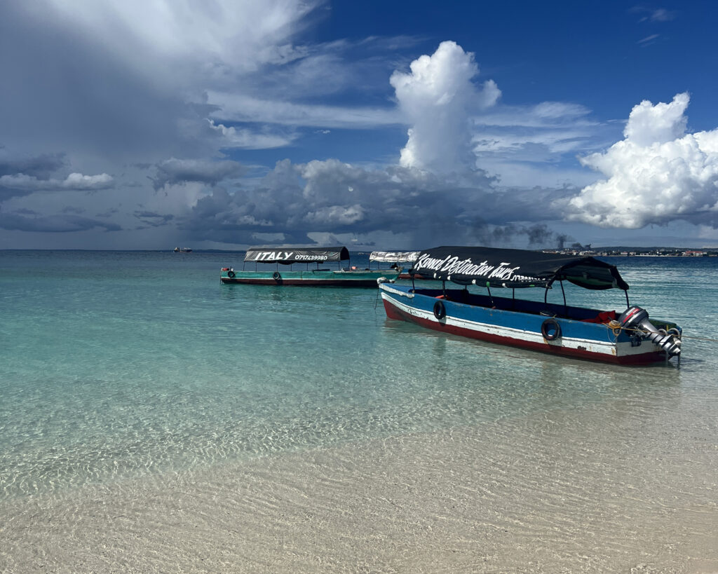 Boat approaching a sandbank in Zanzibar during late afternoon