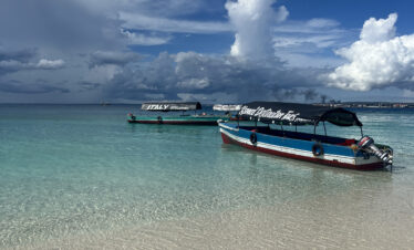 Boat approaching a sandbank in Zanzibar during late afternoon