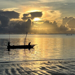 Traditional Fishing Boat at sunrise off the coast of Zanzibar at Jambiani