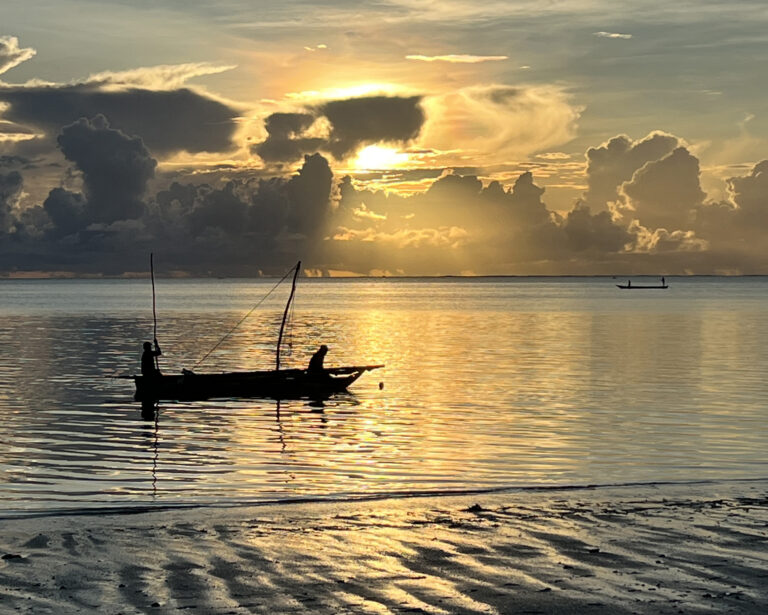 Traditional Fishing Boat at sunrise off the coast of Zanzibar at Jambiani