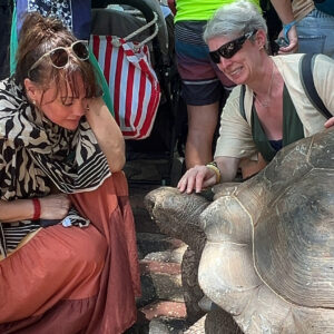 Giant Aldabra tortoise and tourists at Prison Island