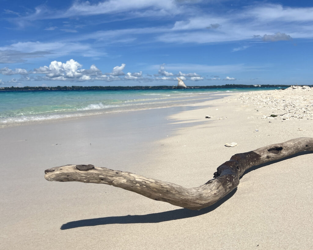 White sand and shallow turquoise water at Nakupenda Beach