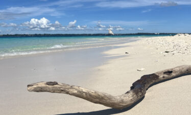 White sand and shallow turquoise water at Nakupenda Beach