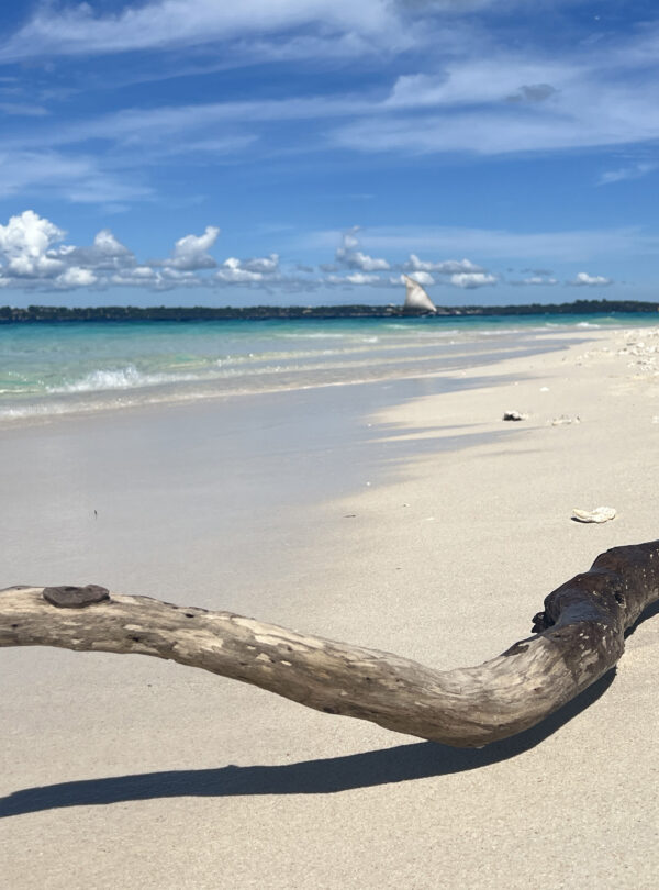 White sand and shallow turquoise water at Nakupenda Beach