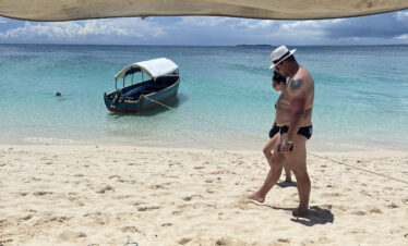 Couple walking quietly on a sandbank in Zanzibar