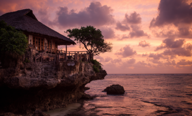 The Rock Restaurant silhouetted against the evening sky in Zanzibar