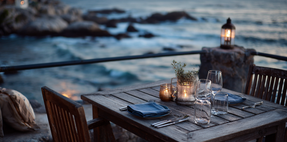 Table setting overlooking the sea at The Rock Restaurant in Zanzibar