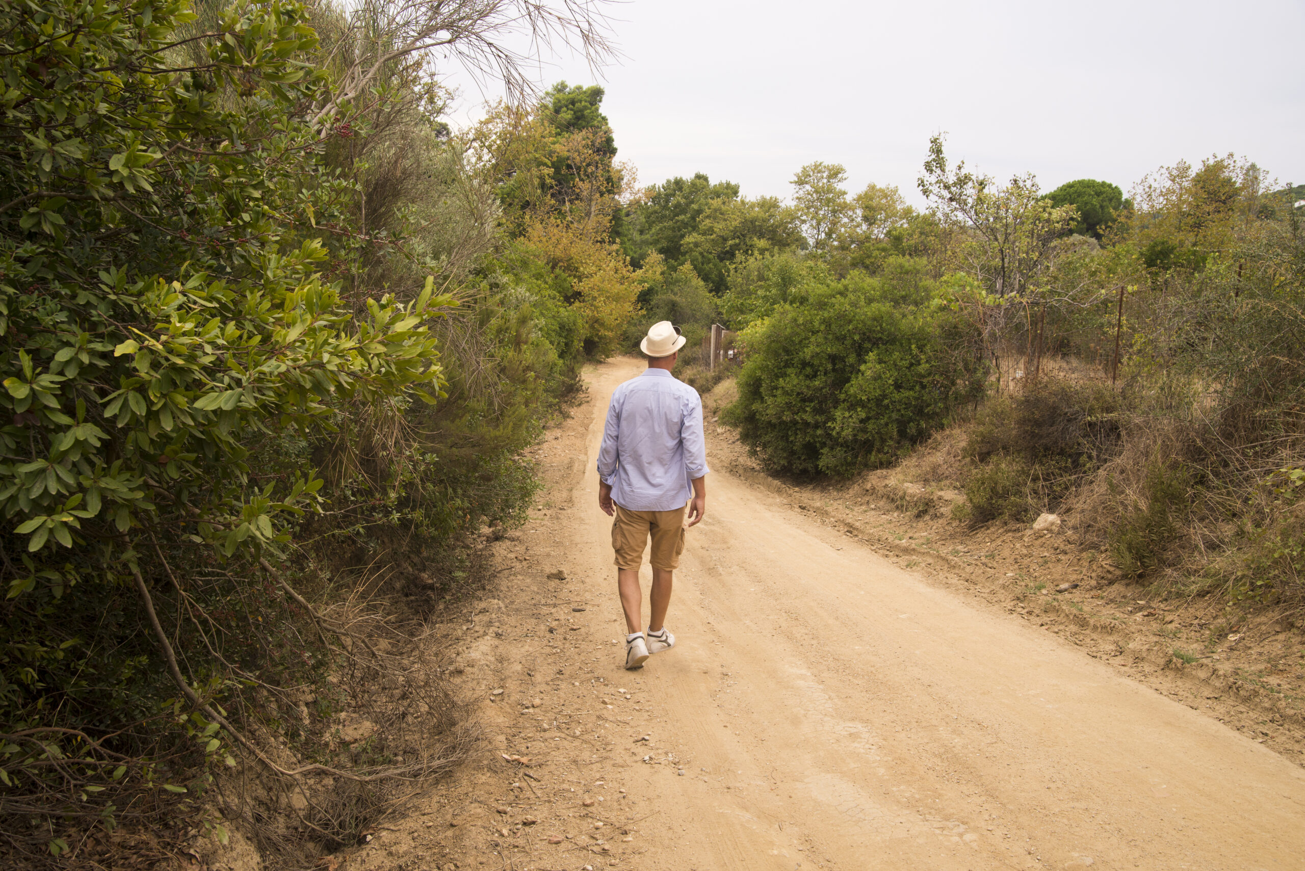 Man walking in Tanzania wilderness during Best Tanzania walking safari experience with professional guide