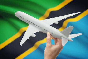 Airplane with Tanzanian flag representing cheap flights to Tanzania for budget travelers