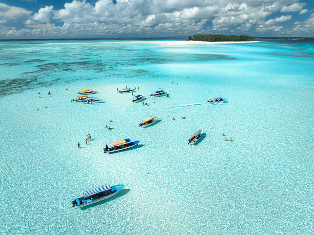 Aerial view of Mnemba Atoll and turquoise waters at the best diving spots in Tanzania