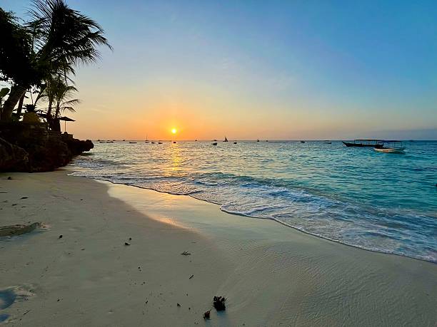 Nungwi Beach sunset view in Zanzibar with golden sky