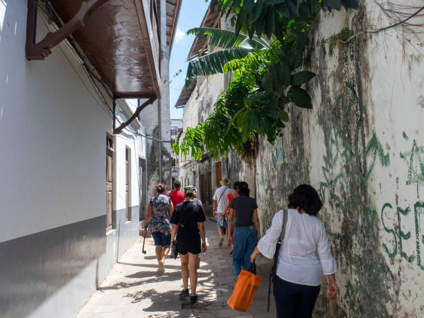Zanzibar travel tourists exploring Stone Town streets in Zanzibar City