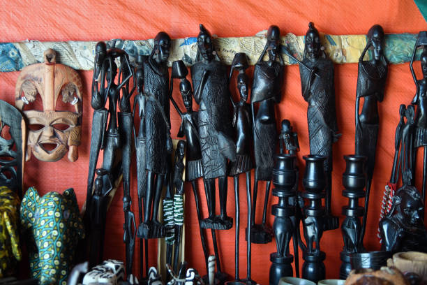Handcrafted Makonde figurines and African souvenirs in a market stall in Mtwara Tanzania highlighting traditional art for Cultural Tourism in Tanzania