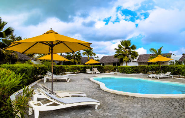 Luxury hotel resort in Zanzibar Tanzania with blue swimming pool and relaxing veranda showcasing comfort for safari travelers
