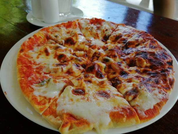 Unique Foods in Zanzibar featuring traditional Zanzibar pizza served on a plate