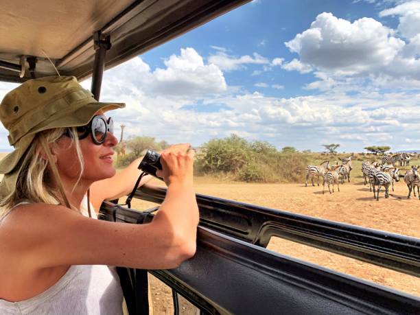 Woman enjoying a safari in Tanzania during the best time to visit
