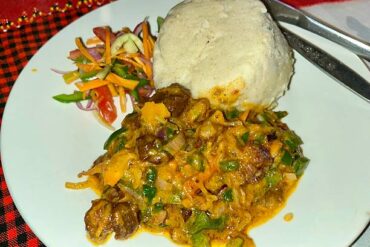 Traditional foods in Tanzania – Ugali served with beef, a popular Tanzanian local dish