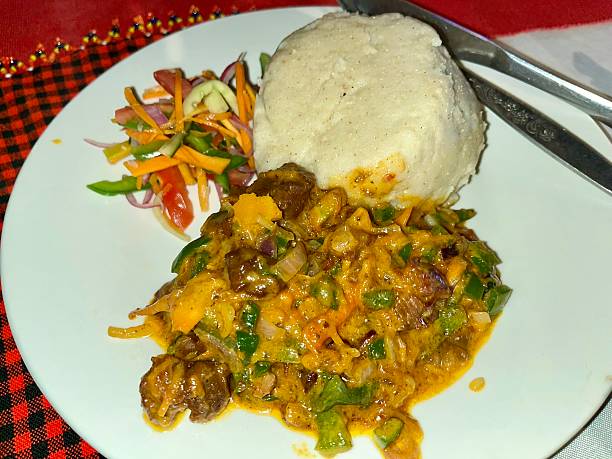 Traditional foods in Tanzania – Ugali served with beef, a popular Tanzanian local dish