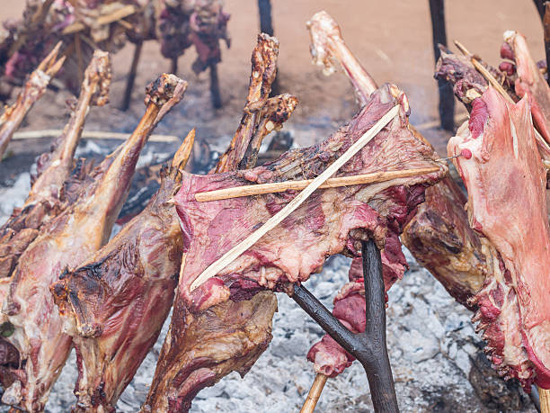 Traditional foods in Tanzania – Nyama Choma grilled meat cooked over fire at a Maasai market