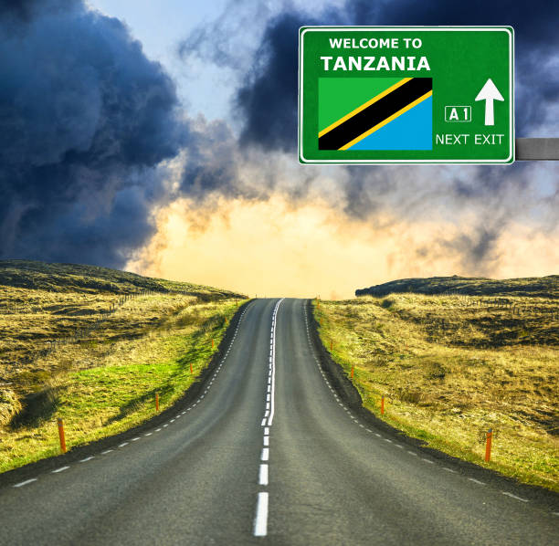 Tanzania road sign against clear blue sky, symbolizing travel and adventure, reasons to visit Tanzania