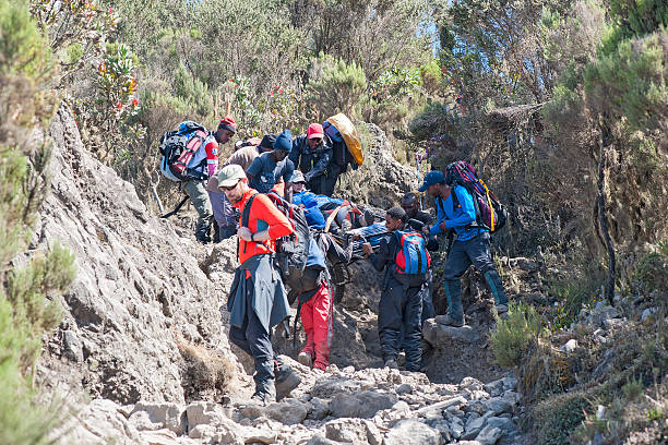 Kilimanjaro climbers supporting each other teamwork
