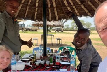Private vs Group Safari in Tanzania couple enjoying romantic private safari lunch experience with JoyTrekking Tours & Safaris