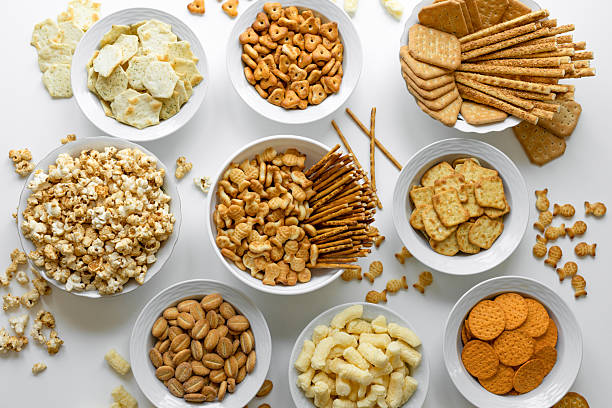 Assorted salty snacks including nuts, biscuits, and trail mix used as energy boosting foods for climbers on Mount Kilimanjaro to maintain stamina and prevent fatigue during trekking.