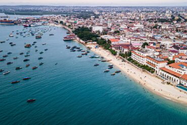 Stone Town Zanzibar skyline view with historic buildings and Indian Ocean coastline