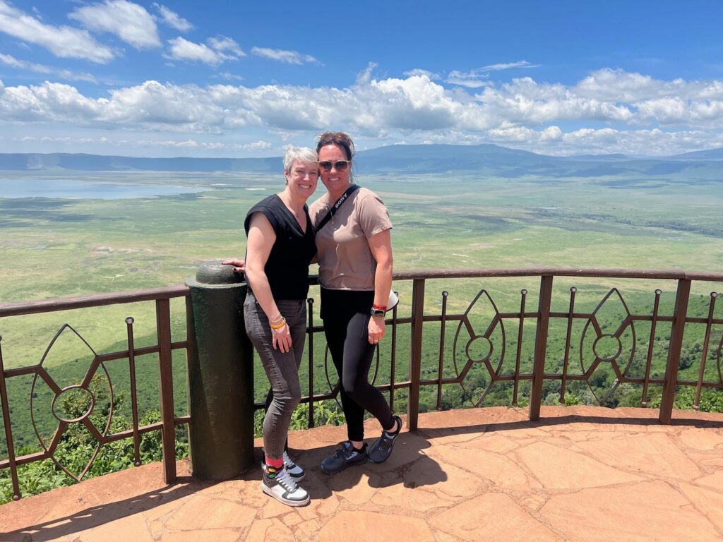 International female travelers enjoying the scenic Ngorongoro Conservation Area view during the Best Ngorongoro Crater Safari Tours 2026