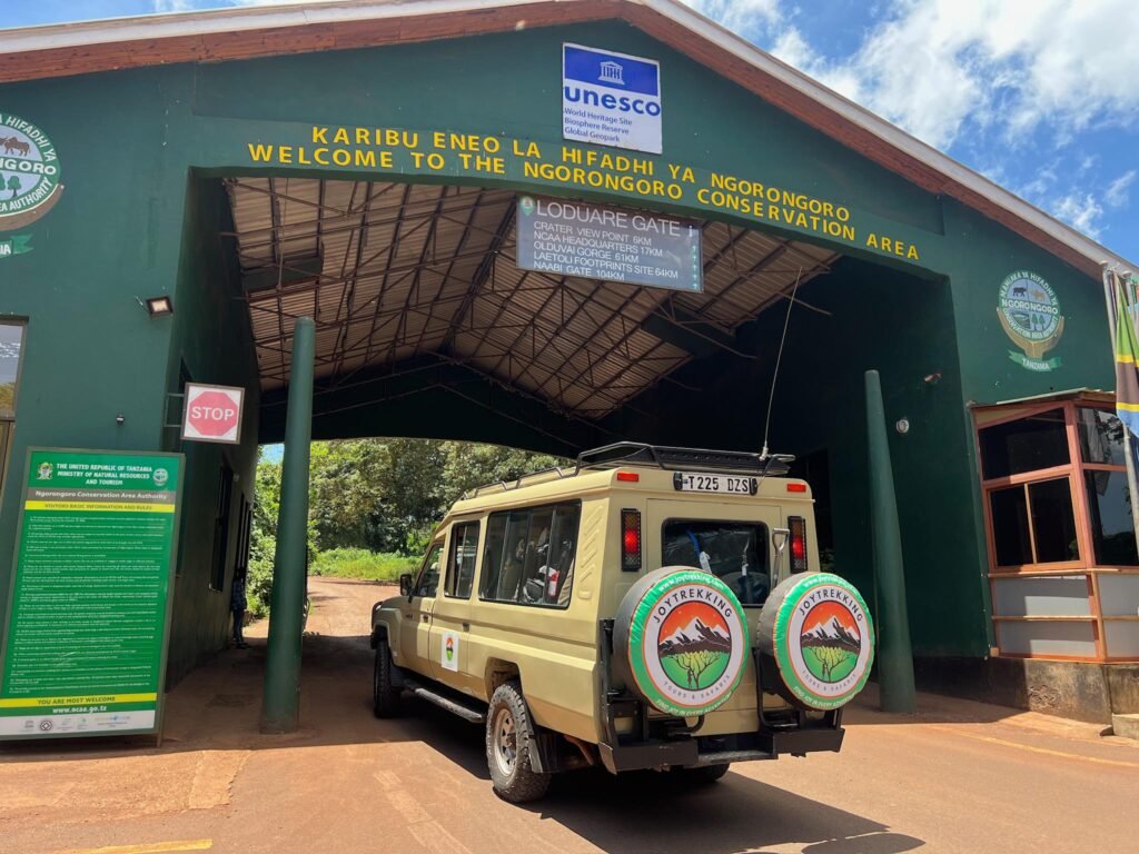 JoyTrekking Tours & Safaris Land Cruiser at the Ngorongoro Conservation Area gate before starting the Best Ngorongoro Crater Safari Tours 2026 adventure