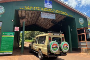 JoyTrekking Tours & Safaris Land Cruiser at the Ngorongoro Conservation Area gate before starting the Best Ngorongoro Crater Safari Tours 2026 adventure