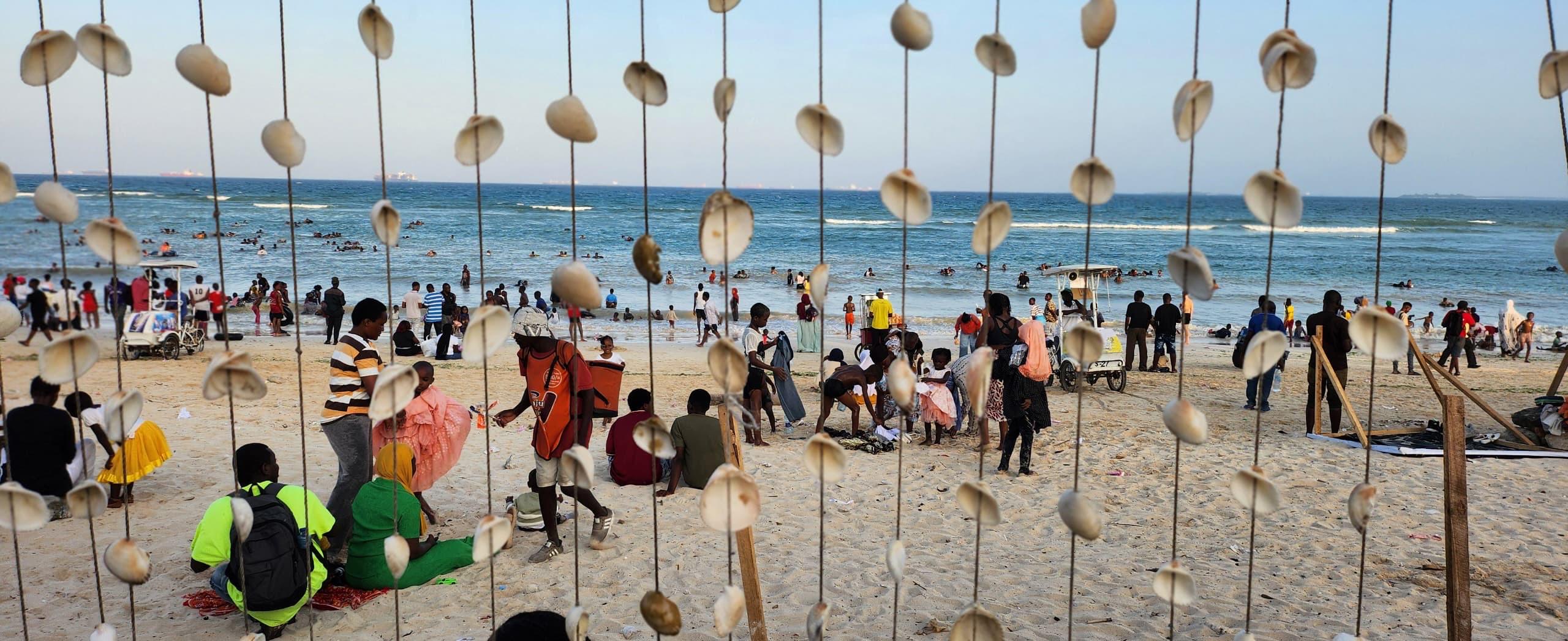African people enjoying Coco Beach in Dar es Salaam during a weekend Dar es Salaam City Tour experience in Tanzania