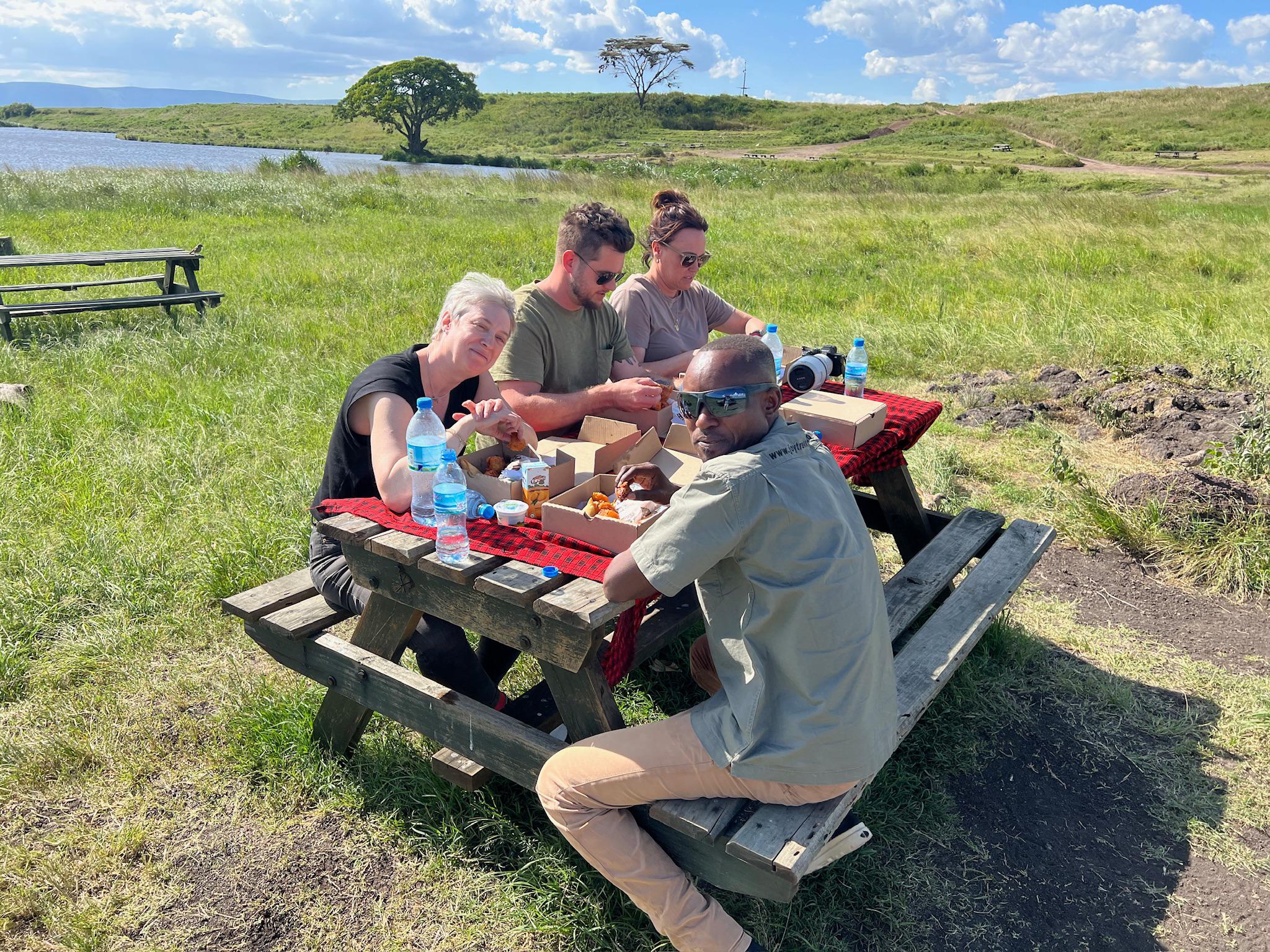 Tanzania safari seasons peaceful picnic experience near hippo pool where visitors stop for lunch during game drive