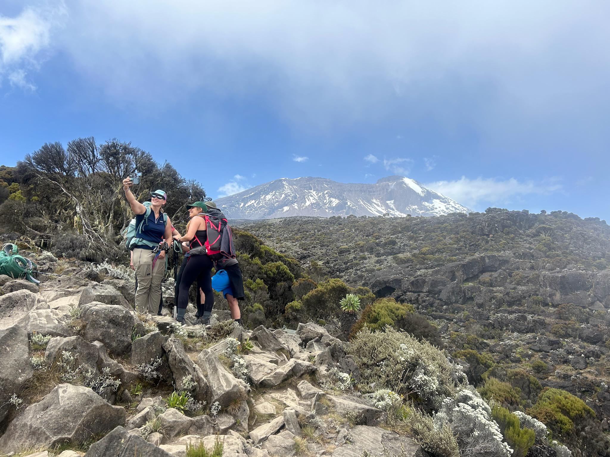 Machame Route Cost vs Other Kilimanjaro Routes climbers group trekking on Mount Kilimanjaro in Tanzania