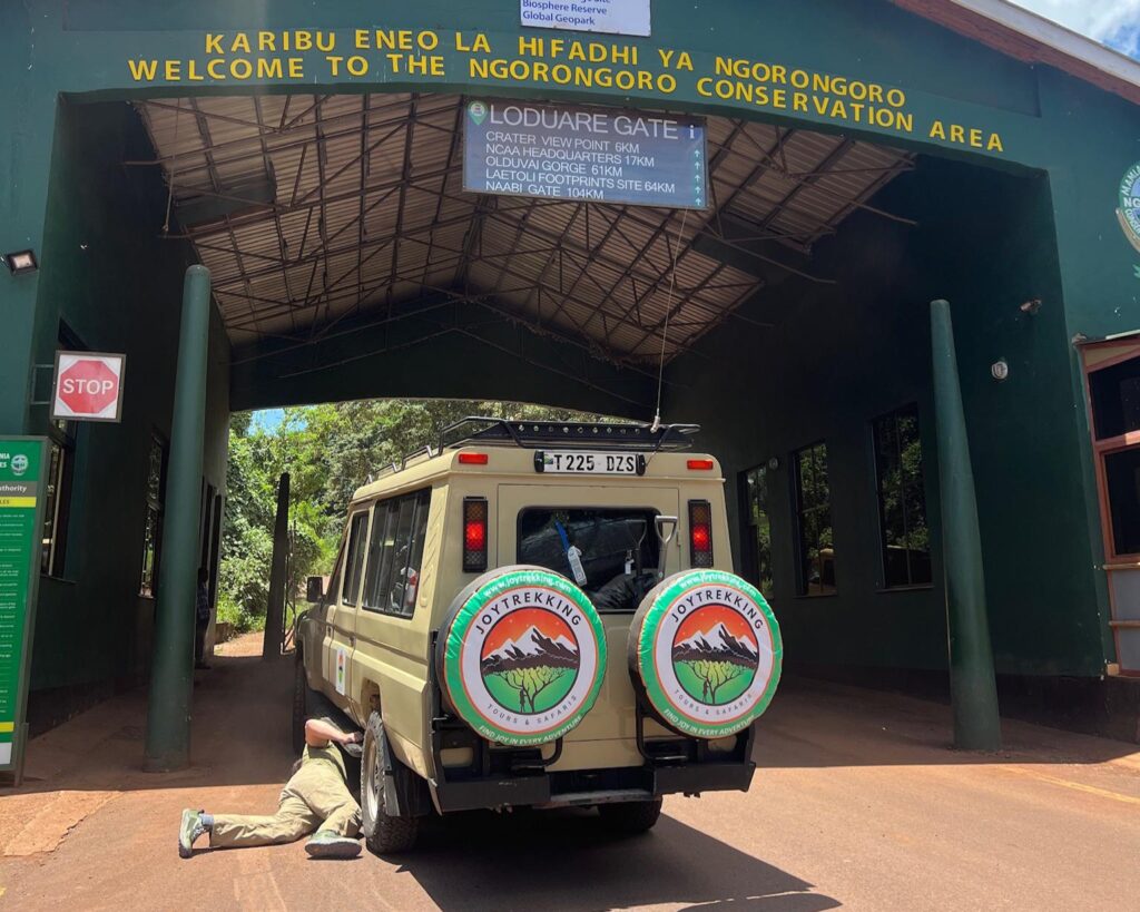 Safari jeep entering Ngorongoro Conservation Area Gate during Tanzania safari transportation method