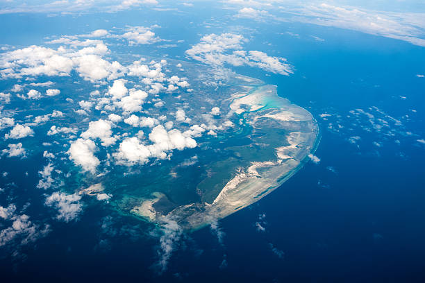 Discover Pemba Island aerial view showing pristine coastline, turquoise Indian Ocean waters and lush tropical landscapes in Tanzania's Zanzibar Archipelago