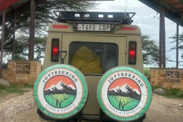 Safari jeep entering Serengeti National Park Tanzania showing the Best Tour Operator in Arusha