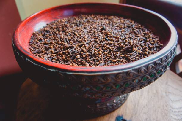 Fresh cloves in a decorative bowl from traditional clove plantations in Pemba Island, Tanzania