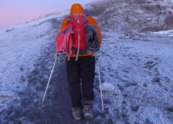 Climbers reaching Uhuru Peak after following the best acclimatization strategy for Kilimanjaro