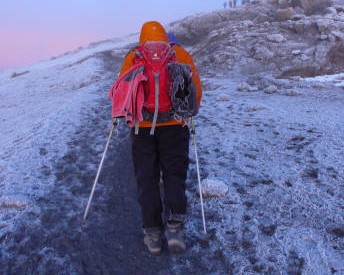 Climbers reaching Uhuru Peak after following the best acclimatization strategy for Kilimanjaro
