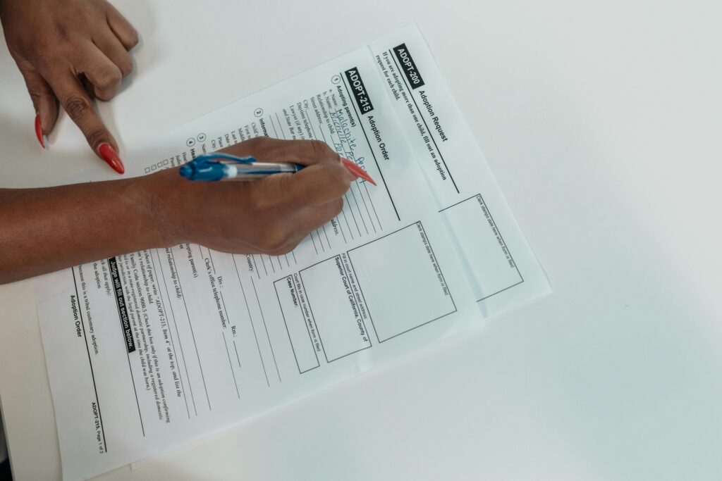 Woman filling out a visa application form representing Tanzania Visa Guide for Tourists (2026) requirements and documentation process for international travelers.