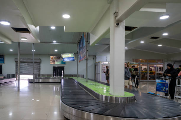Travelers collecting luggage at Zanzibar International Airport before departure after a 5 day Zanzibar trip.